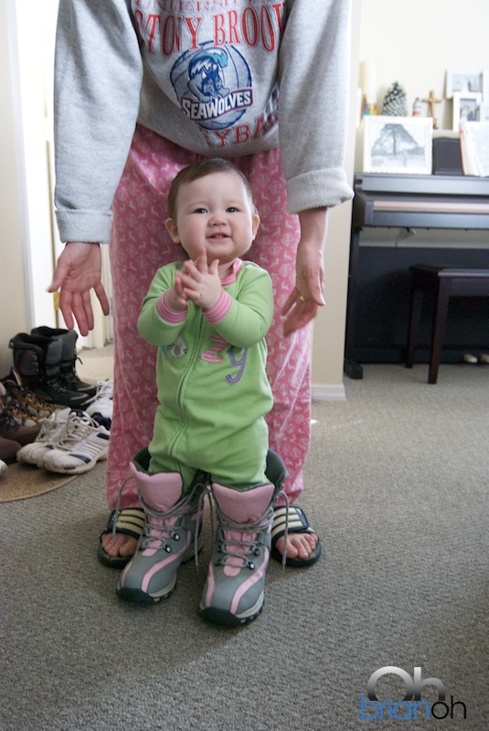 Sarah Oh trying on snow boots